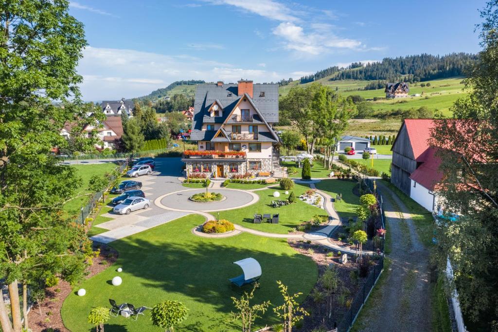 an aerial view of a large house with a park at Willa Pod Kozińcem in Czarna Góra