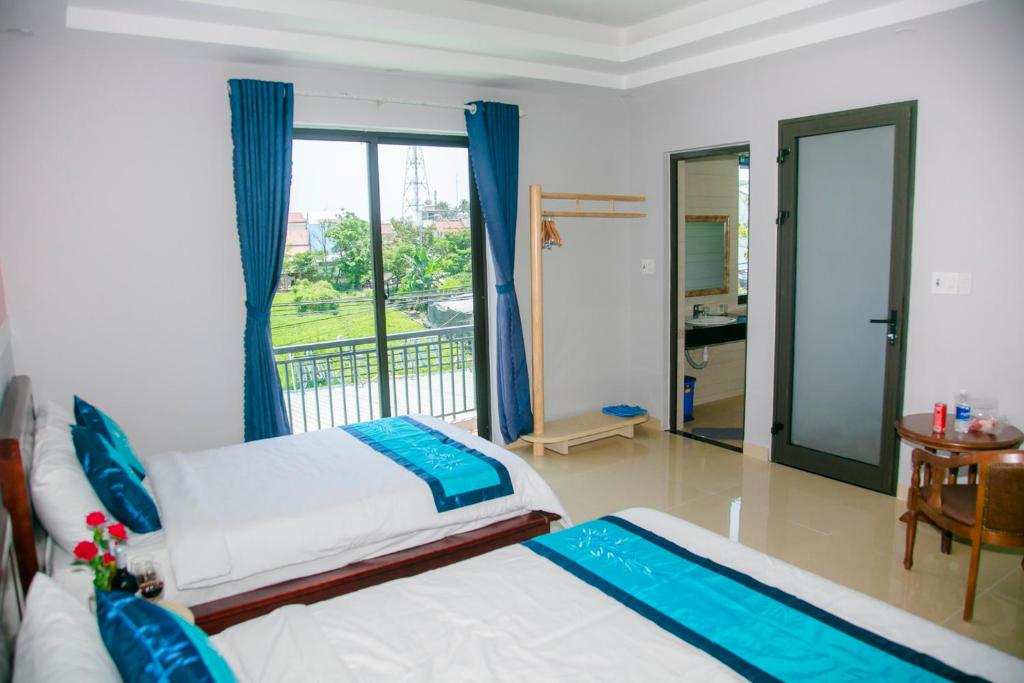 Postel nebo postele na pokoji v ubytování Hào Anh Villa Hội An