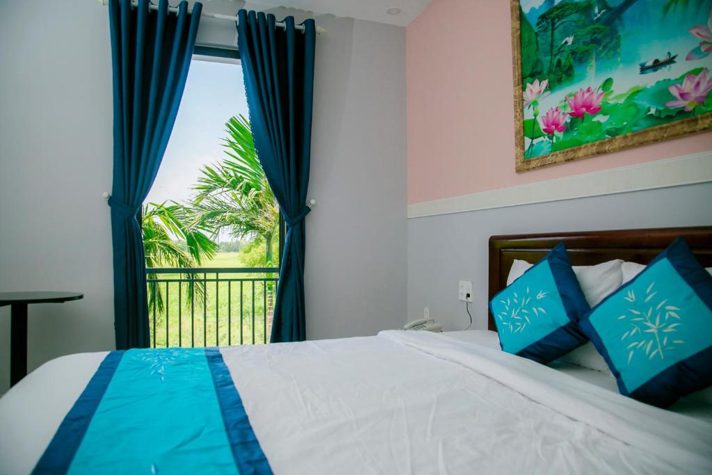 Postel nebo postele na pokoji v ubytování Hào Anh Villa Hội An