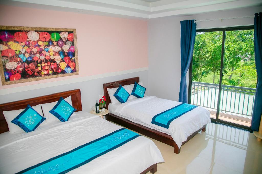 Postel nebo postele na pokoji v ubytování Hào Anh Villa Hội An
