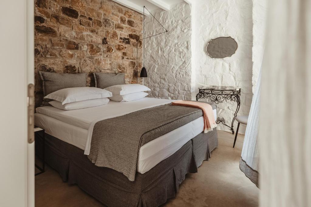 Postel nebo postele na pokoji v ubytování Ayiopetra Exclusive Getaways