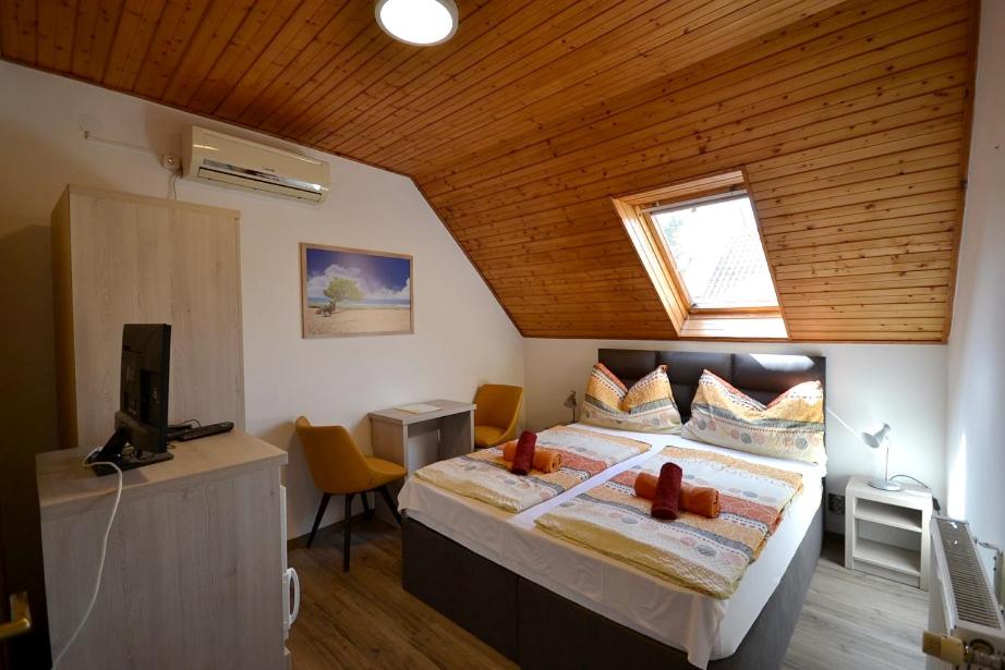 Postel nebo postele na pokoji v ubytování Guest House Silatti - Apartments