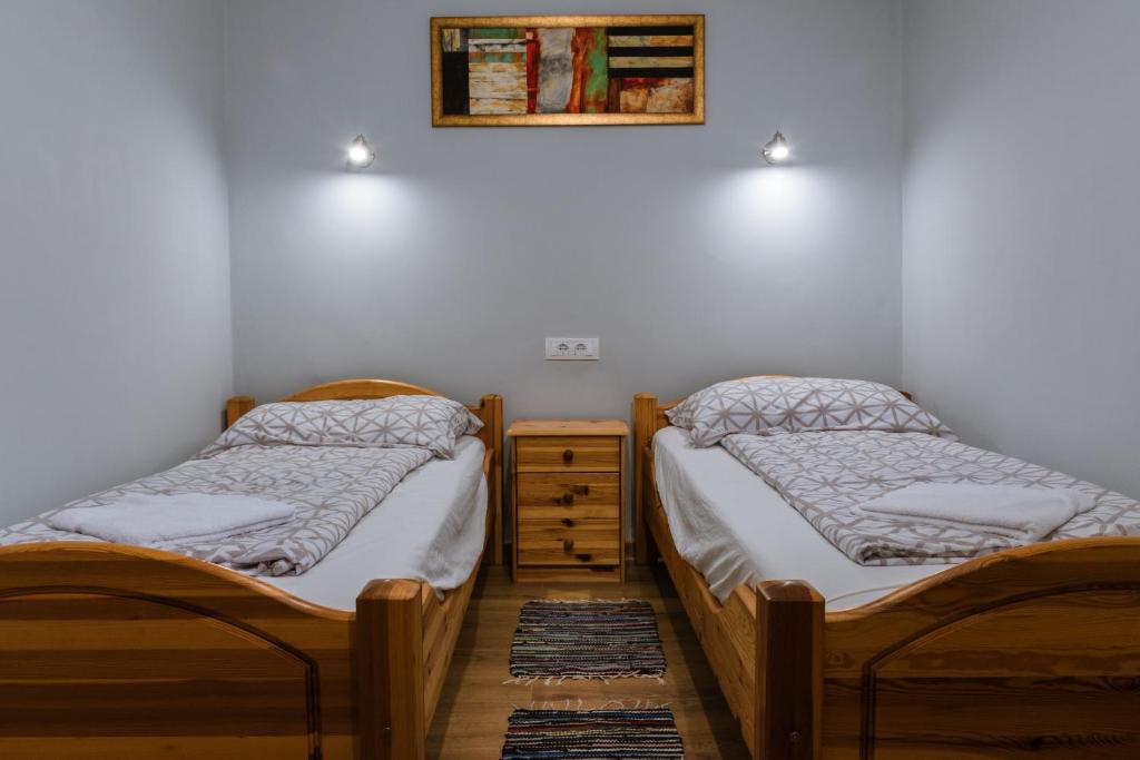 Postel nebo postele na pokoji v ubytování Julia Apartman