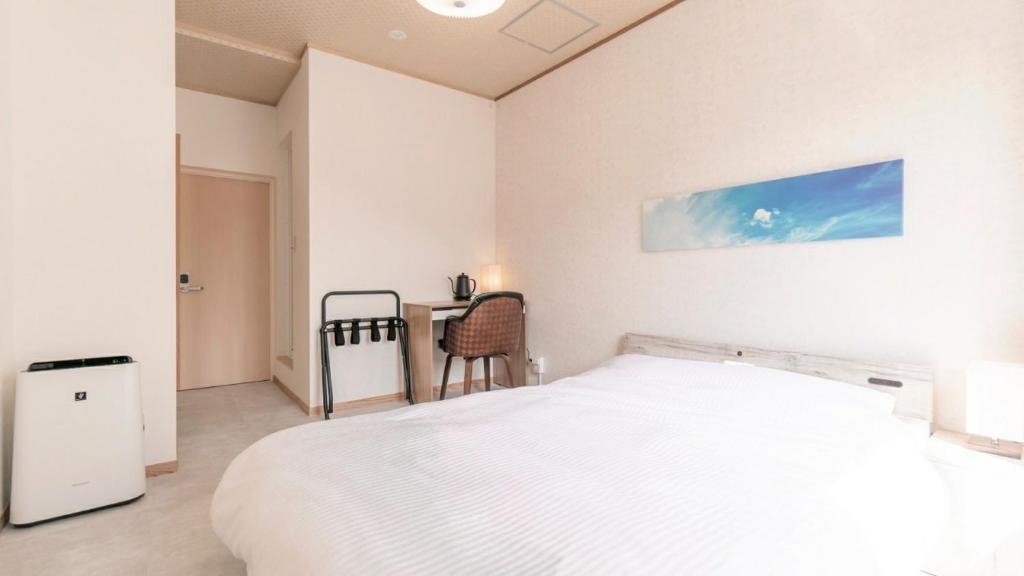 Postel nebo postele na pokoji v ubytování VOYAN Resort Fujiyamanakako Gekkoso
