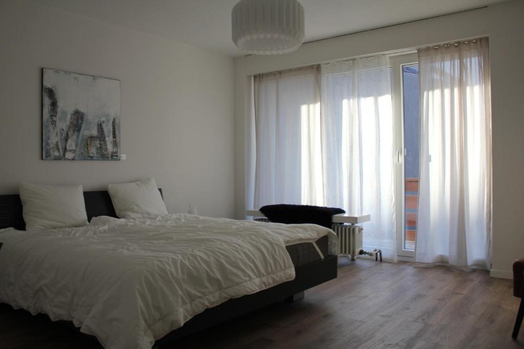 Postel nebo postele na pokoji v ubytování Dorfklatsch Ferienwohnung