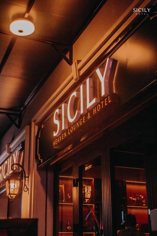 a sign on the side of a restaurant at Sicily Hotel Grand World Phú Quốc in Phú Quốc