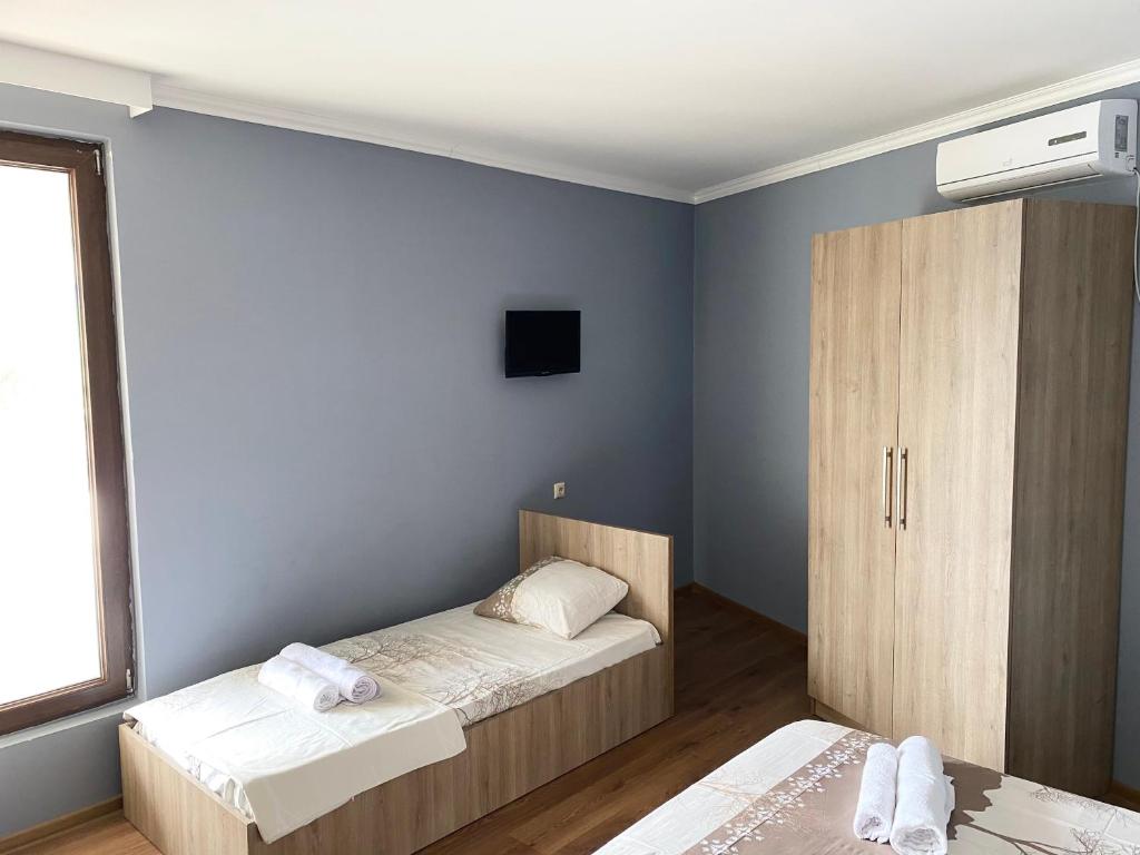Ένα ή περισσότερα κρεβάτια σε δωμάτιο στο Hotel Charli