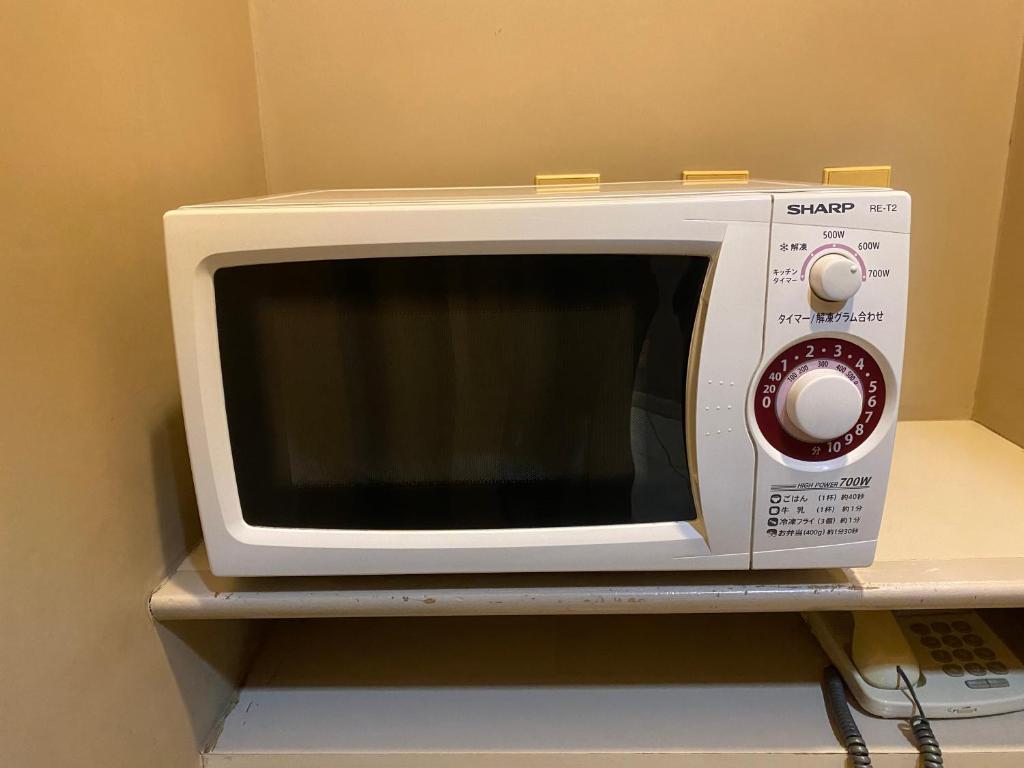 TV a/nebo společenská místnost v ubytování Smile Hotel Tokyo Nishikasai
