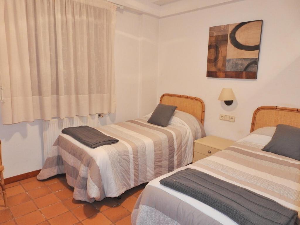Posteľ alebo postele v izbe v ubytovaní CASA UNIFAMILIAR 8 pax con jardín URTX - CERDANYA