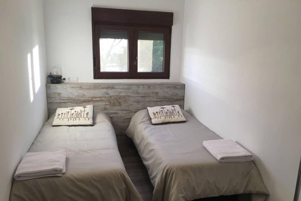 Posteľ alebo postele v izbe v ubytovaní Puerta Laguna - Casa con parcela