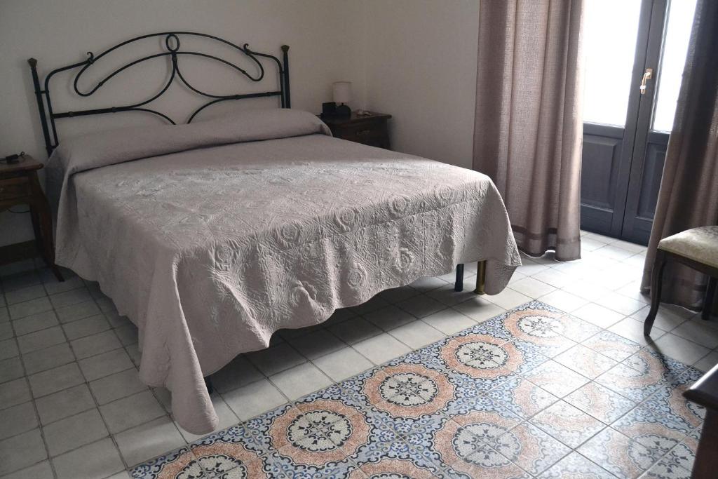 Postel nebo postele na pokoji v ubytování BnB Agorà Panoramic Rooms