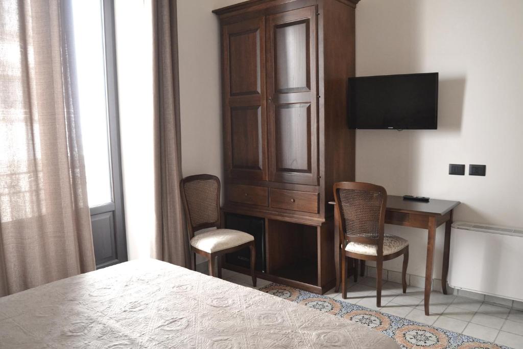 TV a/nebo společenská místnost v ubytování BnB Agorà Panoramic Rooms