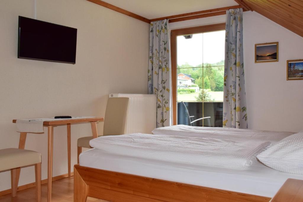 Postel nebo postele na pokoji v ubytování Pension Hohenau
