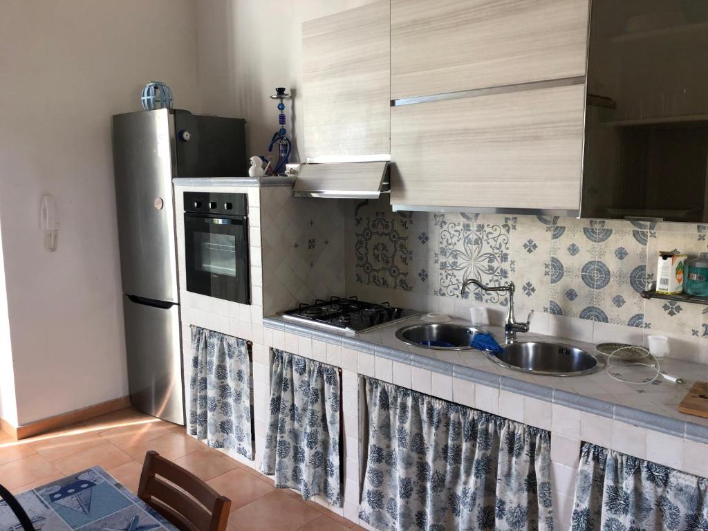 Kuchyň nebo kuchyňský kout v ubytování Pia Beach House