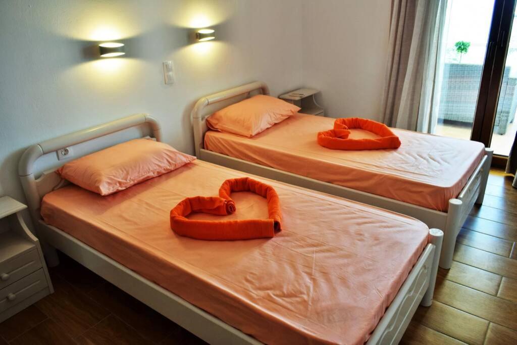 Кровать или кровати в номере Meltemi Appartment