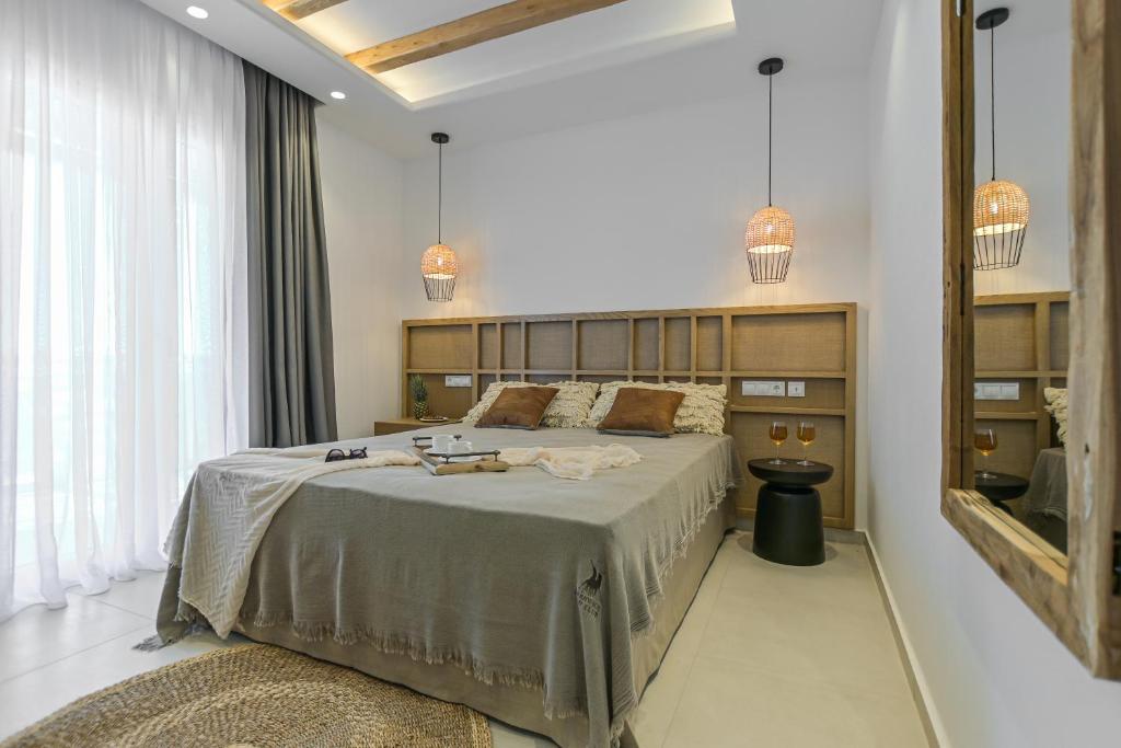 Postel nebo postele na pokoji v ubytování Sea & Olives Suites Hotel and Villas