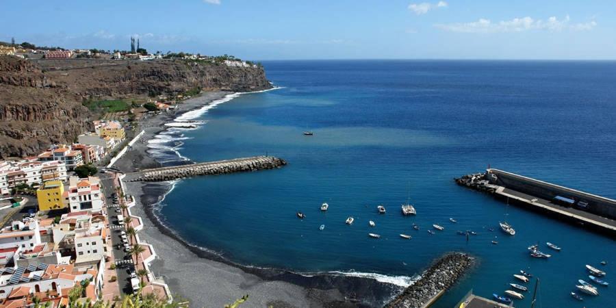 an aerial view of a beach with boats in the water at casa mariposa in Playa de Santiago