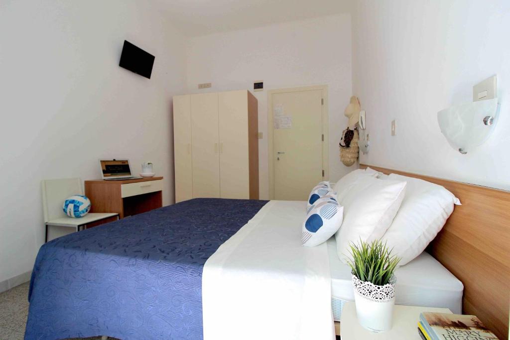 Postel nebo postele na pokoji v ubytování Hotel Kelly