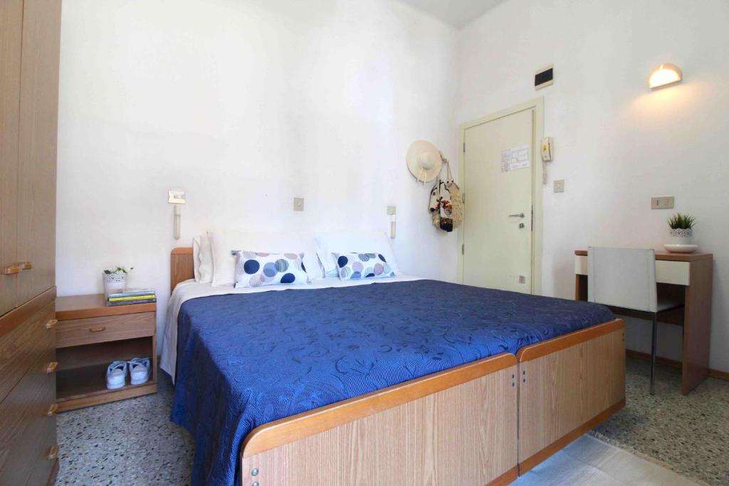 Postel nebo postele na pokoji v ubytování Hotel Kelly