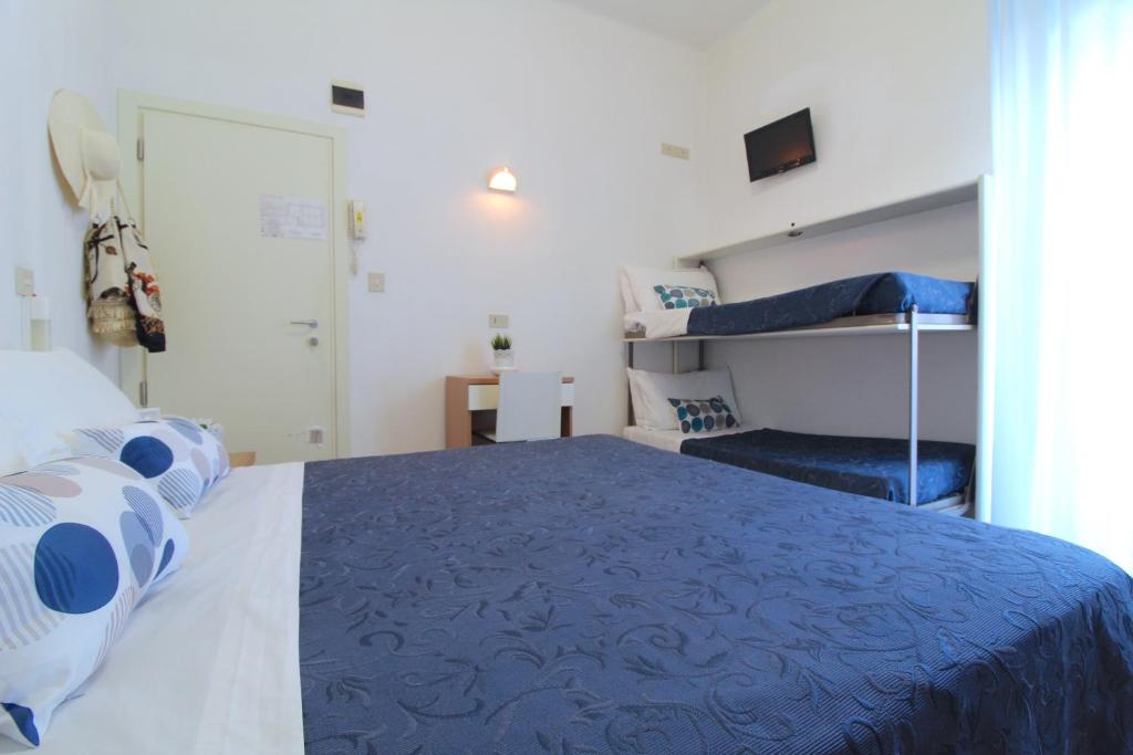 Postel nebo postele na pokoji v ubytování Hotel Kelly