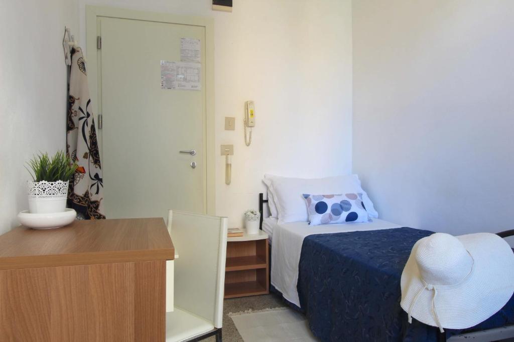 Postel nebo postele na pokoji v ubytování Hotel Kelly