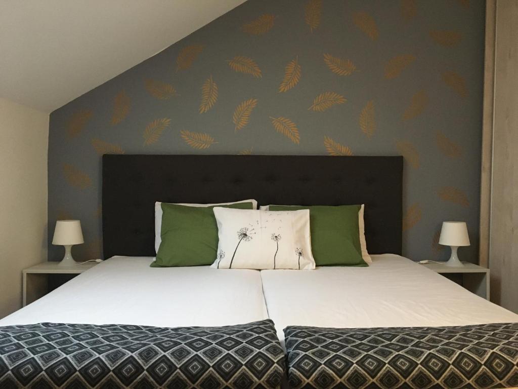 A bed or beds in a room at Bóbita Apartman