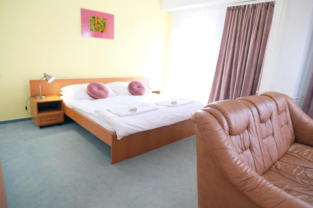 Posteľ alebo postele v izbe v ubytovaní Art Hotel