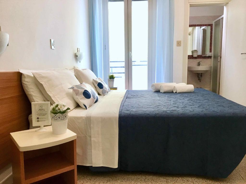 Postel nebo postele na pokoji v ubytování Hotel Kelly