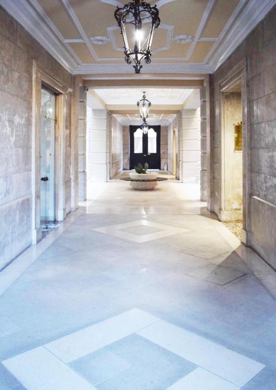 a hallway of a building with a chandelier at Ad Maiora Salento in Lecce