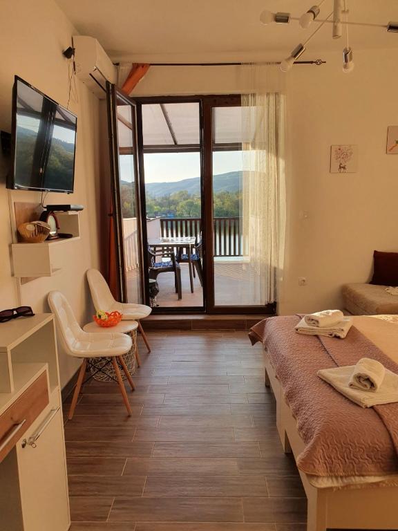 TV i/ili multimedijalni sistem u objektu Zen Apartment