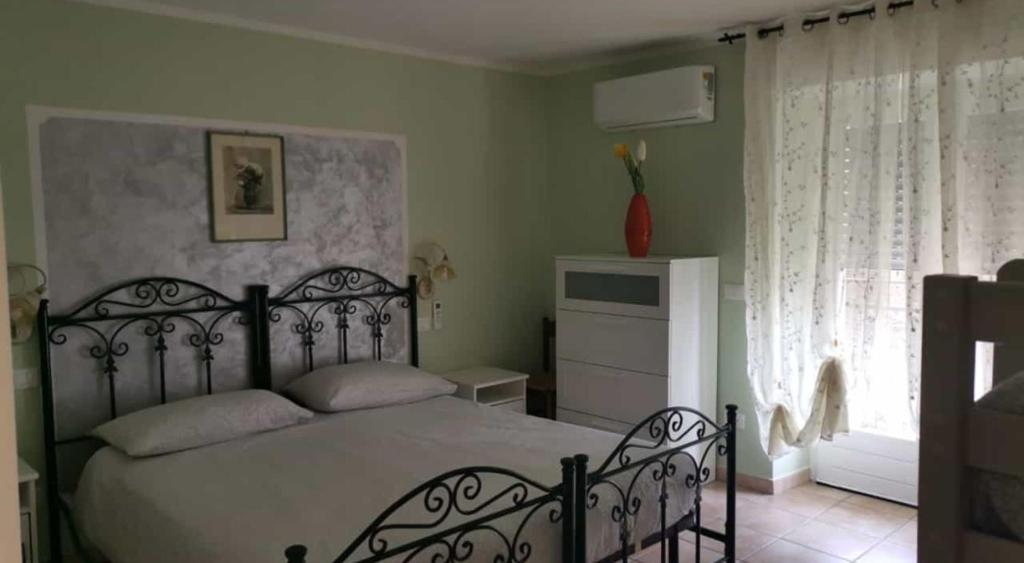 Postel nebo postele na pokoji v ubytování Casa Cristina - Vista Lago