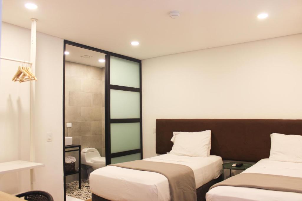 Postel nebo postele na pokoji v ubytování 574 Hotel
