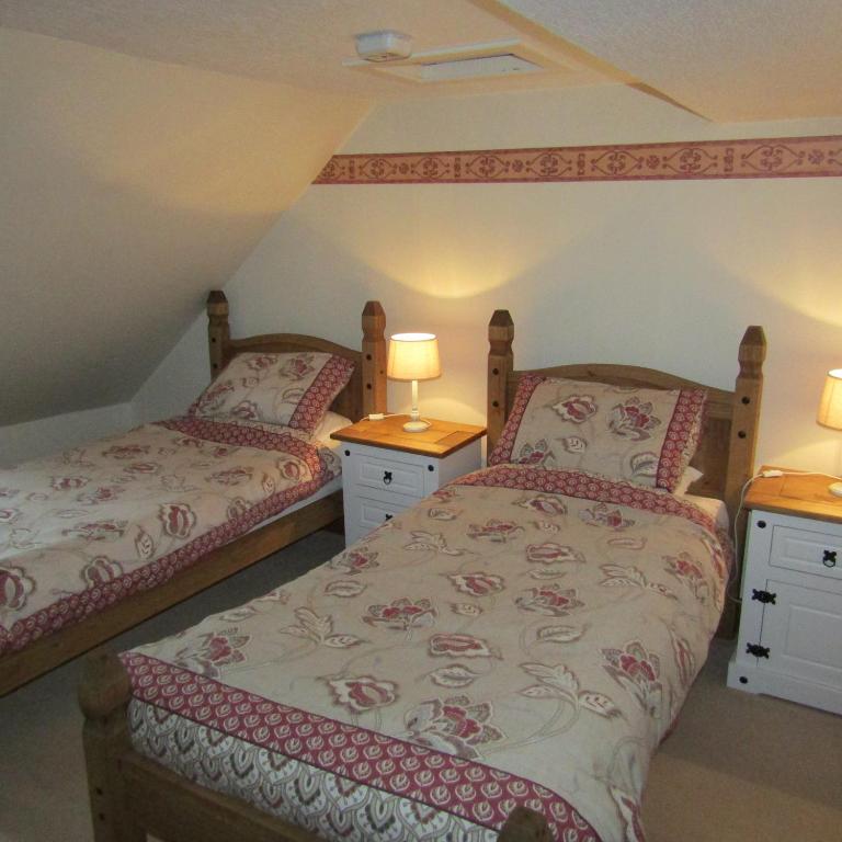 Postel nebo postele na pokoji v ubytování Barnkirk Holidays