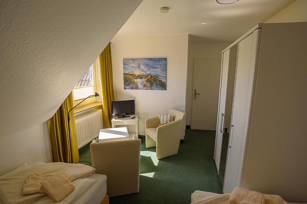 Postel nebo postele na pokoji v ubytování Pension Luuward 3 Sterne superior Hotel