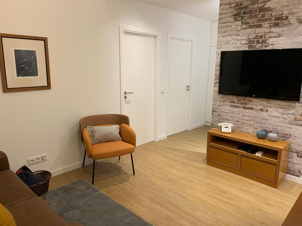 TV a/nebo společenská místnost v ubytování Palace House Apartment