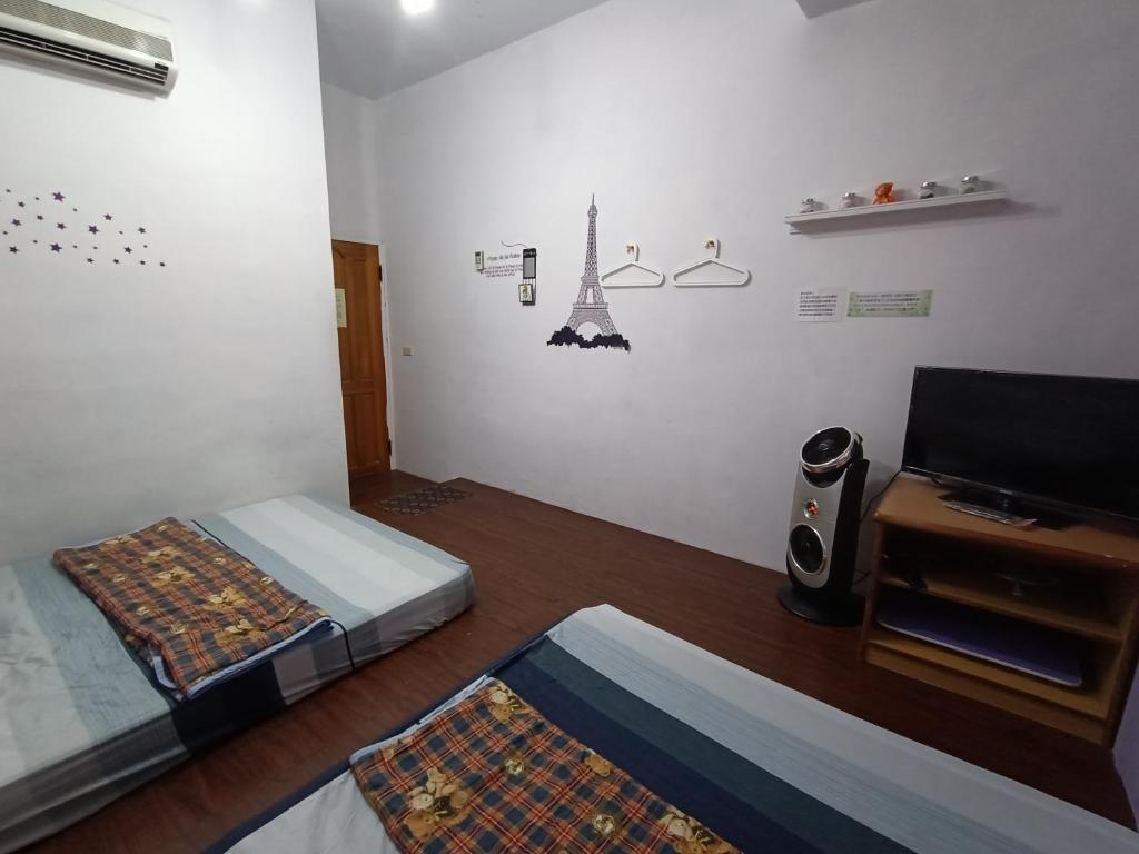 Postel nebo postele na pokoji v ubytování Ludao B&B