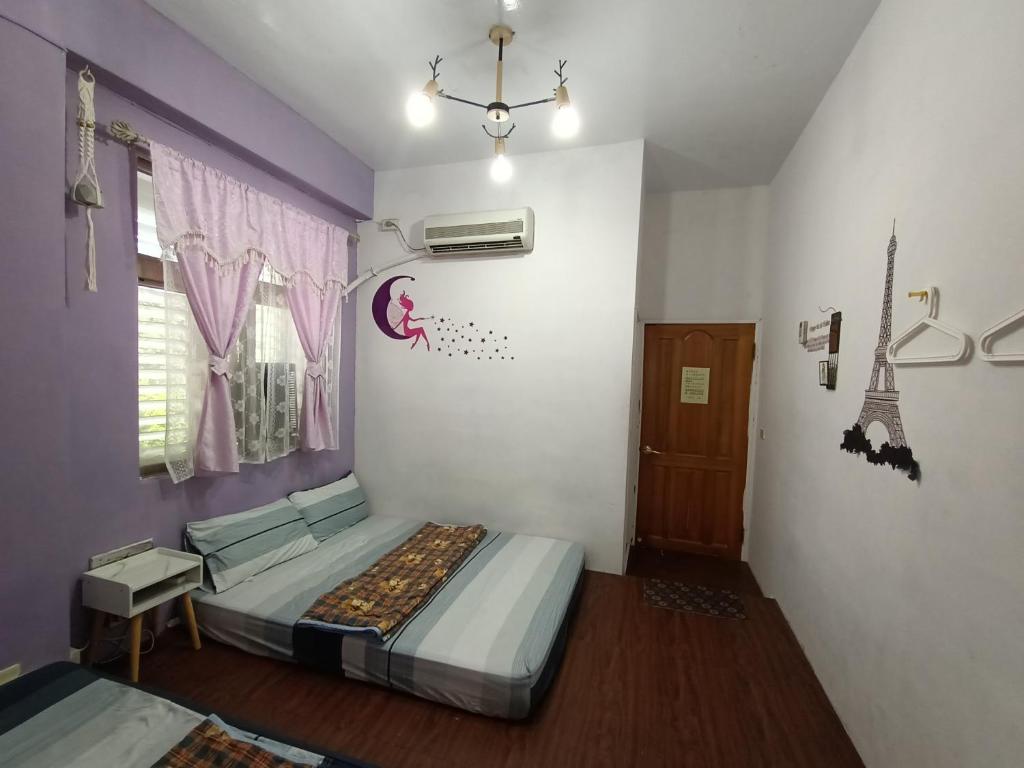 Postel nebo postele na pokoji v ubytování Ludao B&B