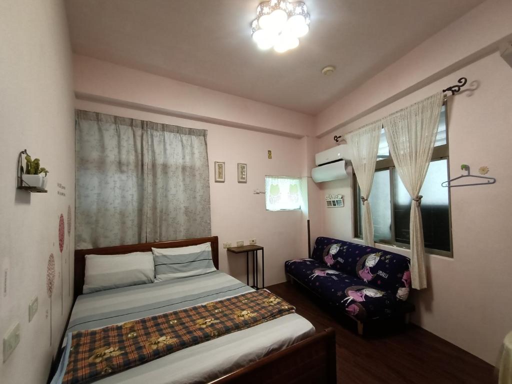Postel nebo postele na pokoji v ubytování Ludao B&B