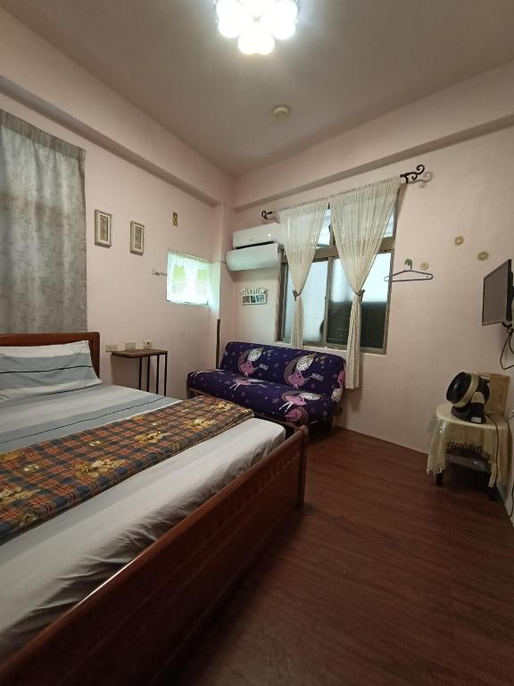 Postel nebo postele na pokoji v ubytování Ludao B&B