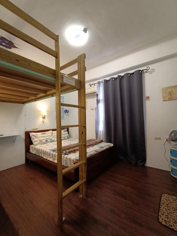 Postel nebo postele na pokoji v ubytování Ludao B&B