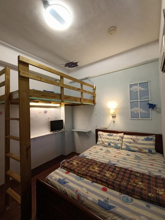 Postel nebo postele na pokoji v ubytování Ludao B&B