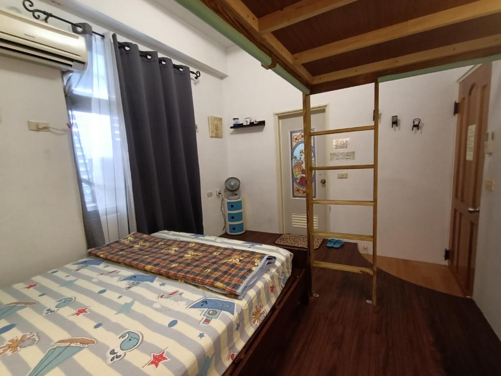 Postel nebo postele na pokoji v ubytování Ludao B&B