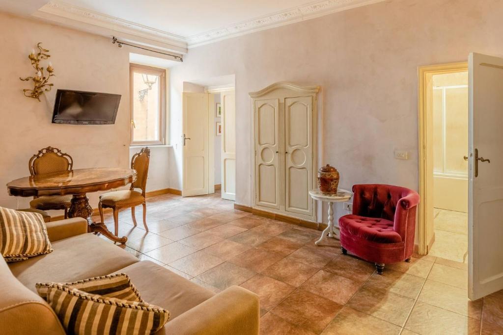 a living room with a couch and a table at Rome right in the ancient historical center two bedrooms two bath, Up to 6 pax in Rome