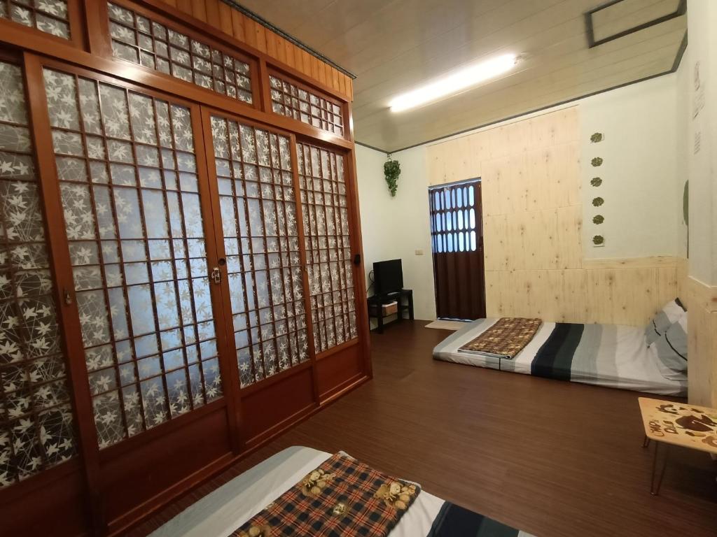Postel nebo postele na pokoji v ubytování Ludao B&B