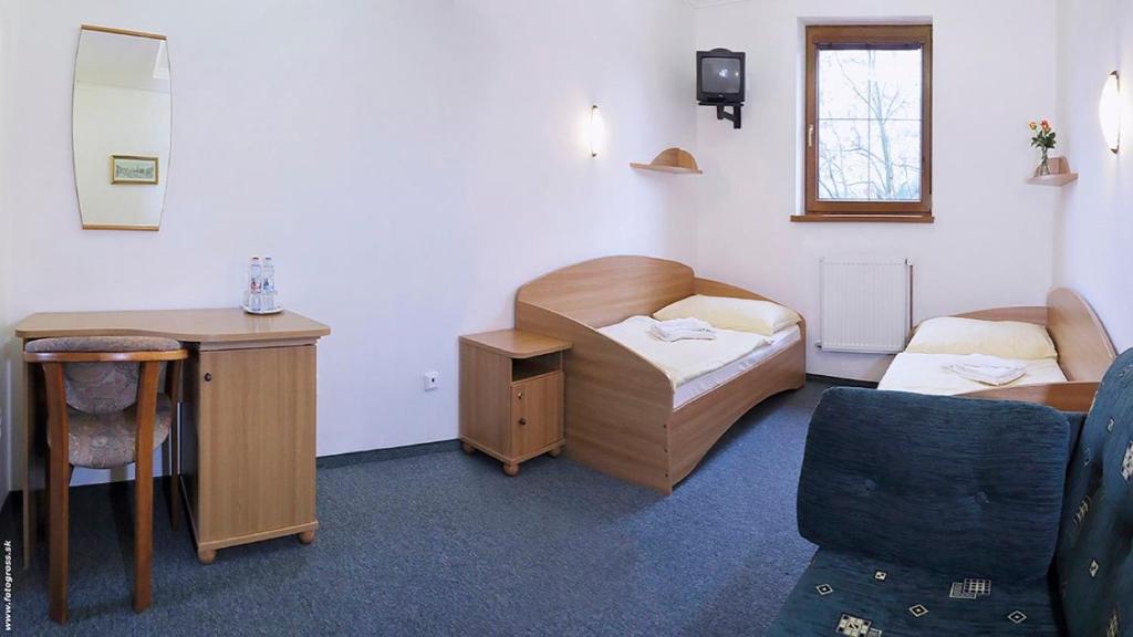 Postel nebo postele na pokoji v ubytování Penzión DRUŽBA Bojnice