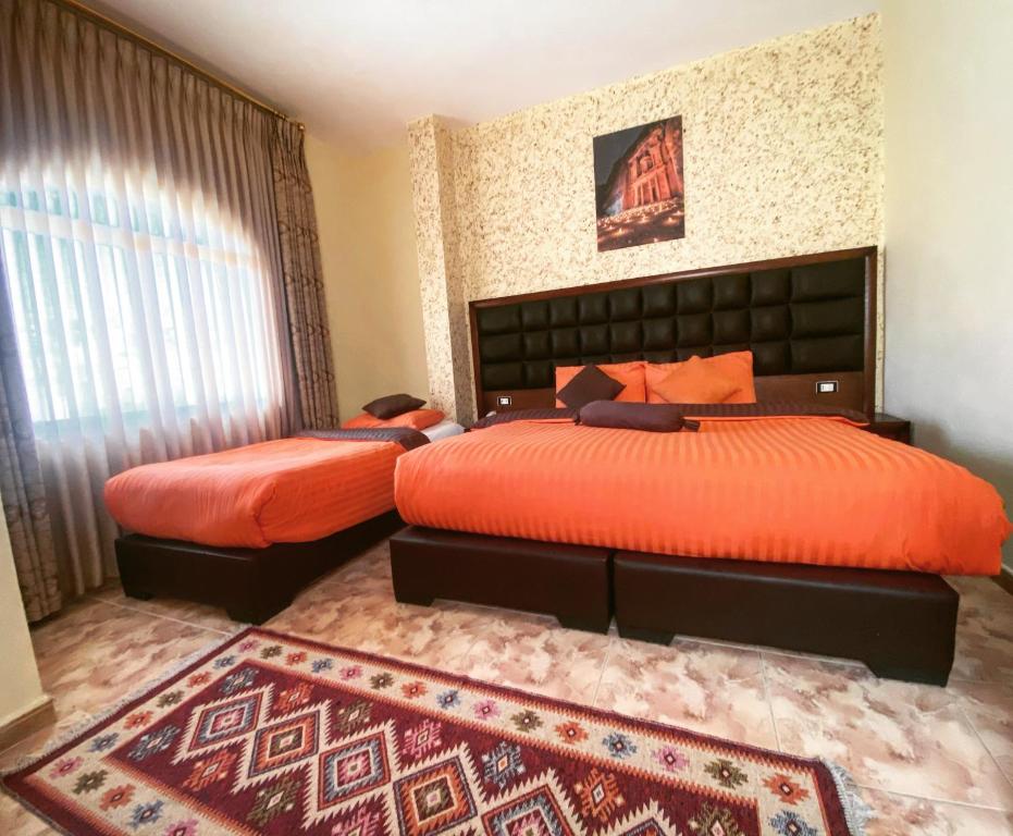 Postel nebo postele na pokoji v ubytování Anbat Midtown Hotel