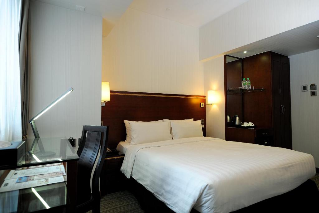 Postel nebo postele na pokoji v ubytování Brighton Hotel Hong Kong