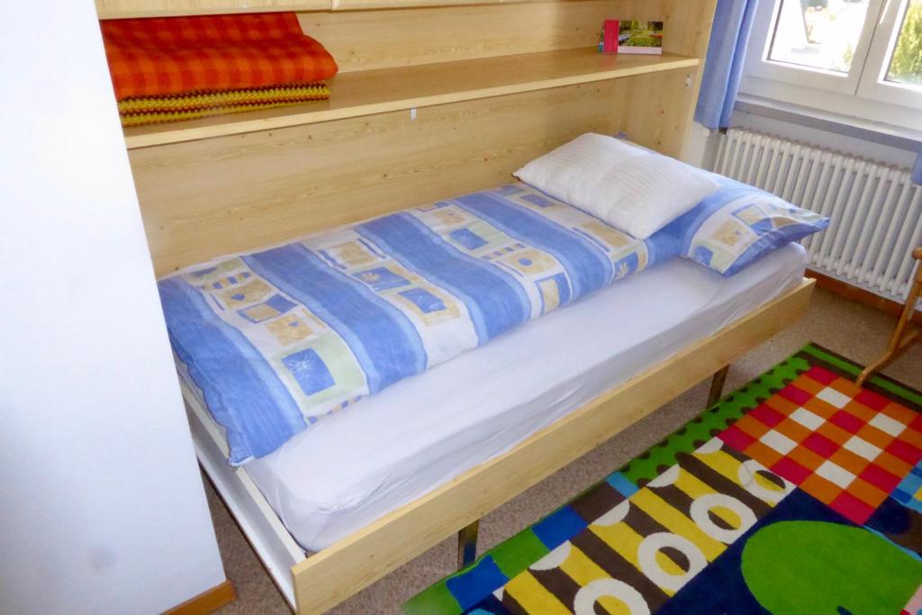 Postel nebo postele na pokoji v ubytování Guntli’s family Guesthouse