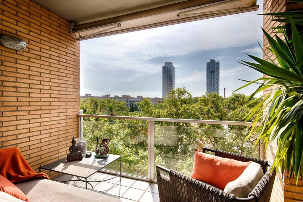 a balcony with a table and a view of the city at Great and Seaside Flat in Barcelona