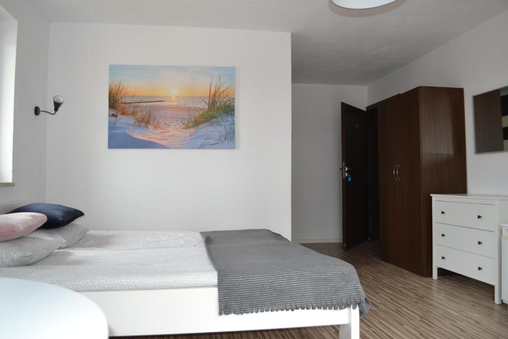 Łóżko lub łóżka w pokoju w obiekcie D.W Nawigator